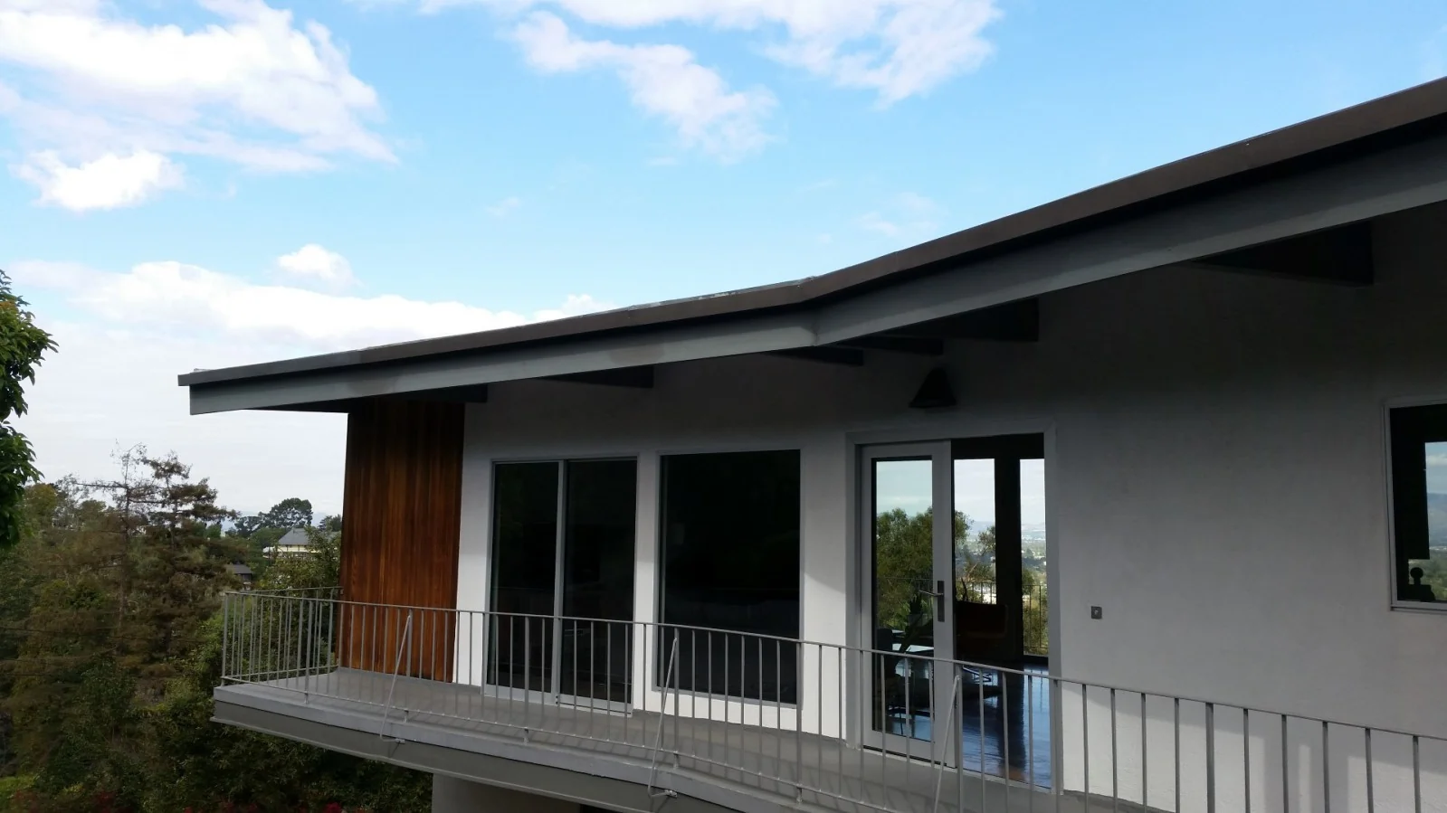 Custom rain gutters following the roofline of a modern home